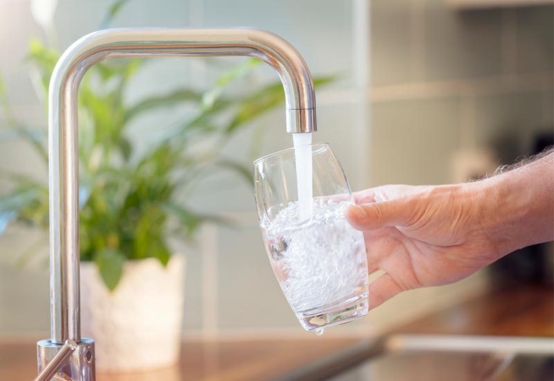 filling a glass with water from the tap